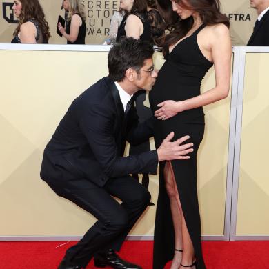 John Stamos (L) and Caitlin McHugh